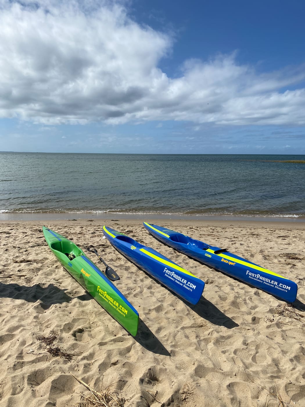 Nelo Surfski Lengths, a 540, 550 and 560 on the beach side by side